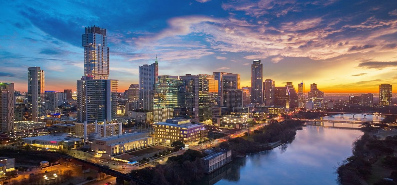 a city skyline at sunset