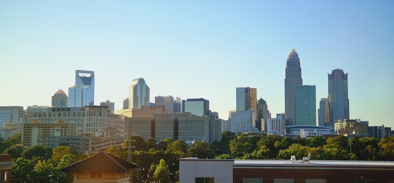 a city skyline with a clock tower in the foreground