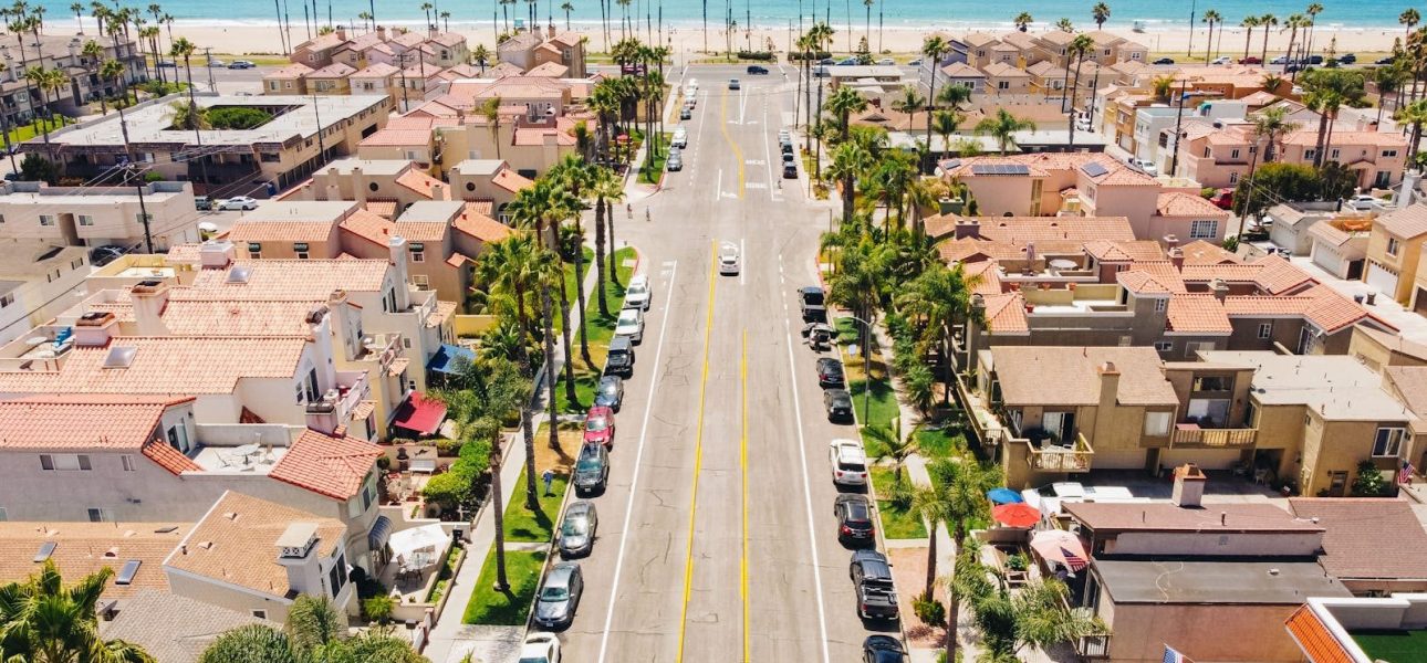 Explore Huntington Beach's beautiful neighborhood and coastline in this vibrant aerial shot.