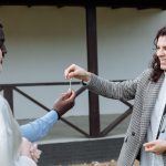 Real estate agent handing over house keys