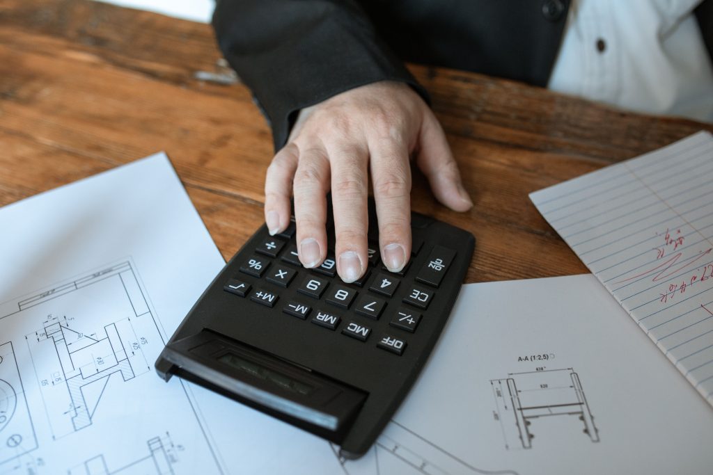 Accountant working at a desk with a calculator