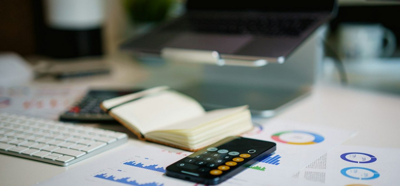 Financial charts and a calculator, evaluating boutique private credit opportunities