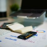 Financial charts and a calculator, evaluating boutique private credit opportunities