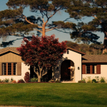 Full-color photo of an American single-family rental home at golden hour, representing DSCR rental-loan financing