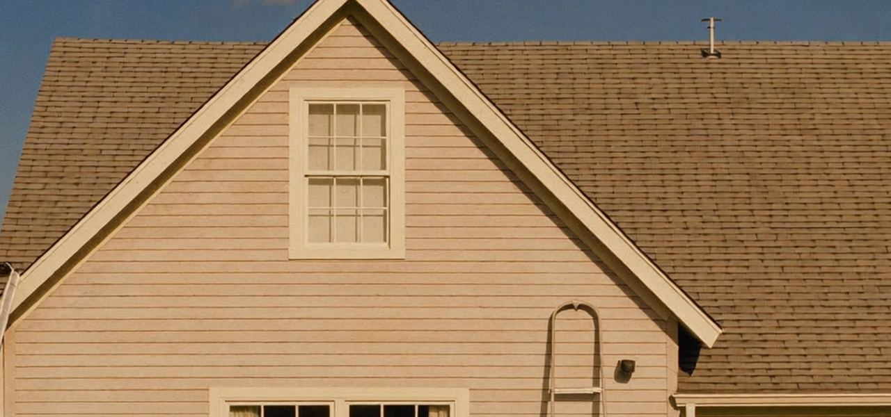 Full-color photo of an American single-family suburban home being repainted with a ladder, representing SFR and RTL renovation financing