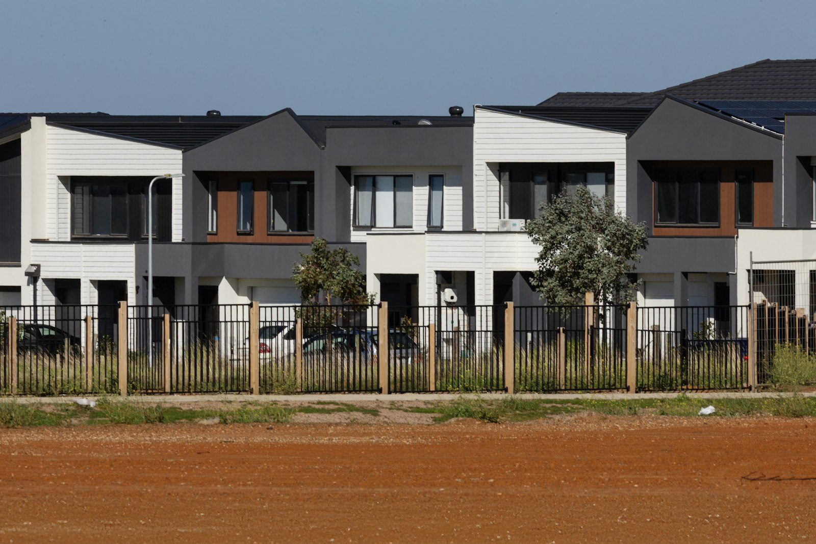 A finished row of modern rental townhomes ready for lease-up