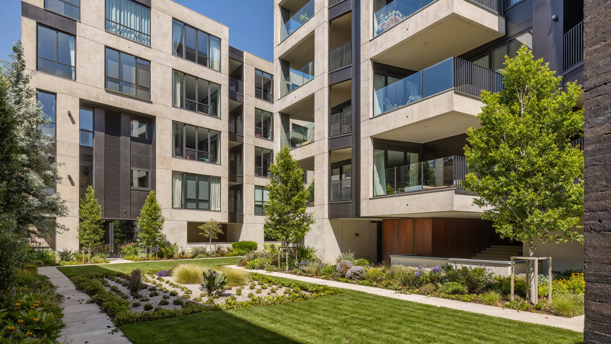 Modern garden-style apartment community with landscaped courtyard and pool in Atlanta, Georgia