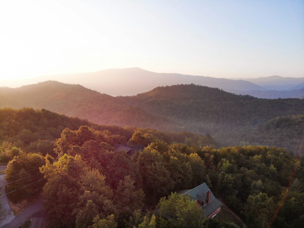 Full-color photo of a mountain cabin short-term rental exterior in the Smoky Mountains of Tennessee