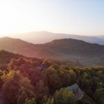 Full-color photo of a mountain cabin short-term rental exterior in the Smoky Mountains of Tennessee